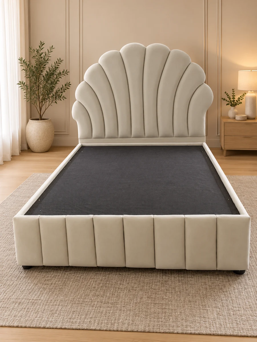 Pale scalloped upholstered bed
